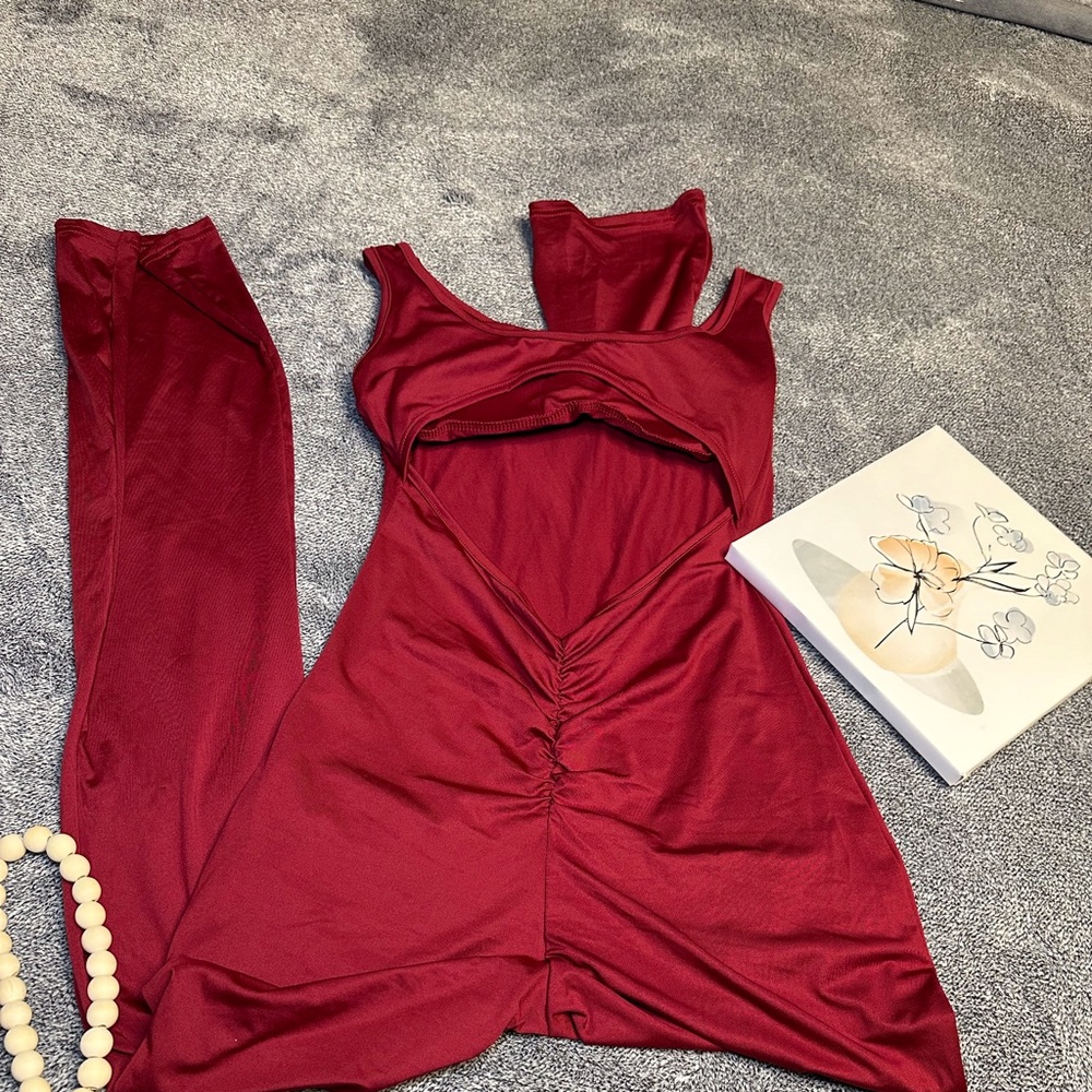 Jumpsuit in wine red very no tags but is new